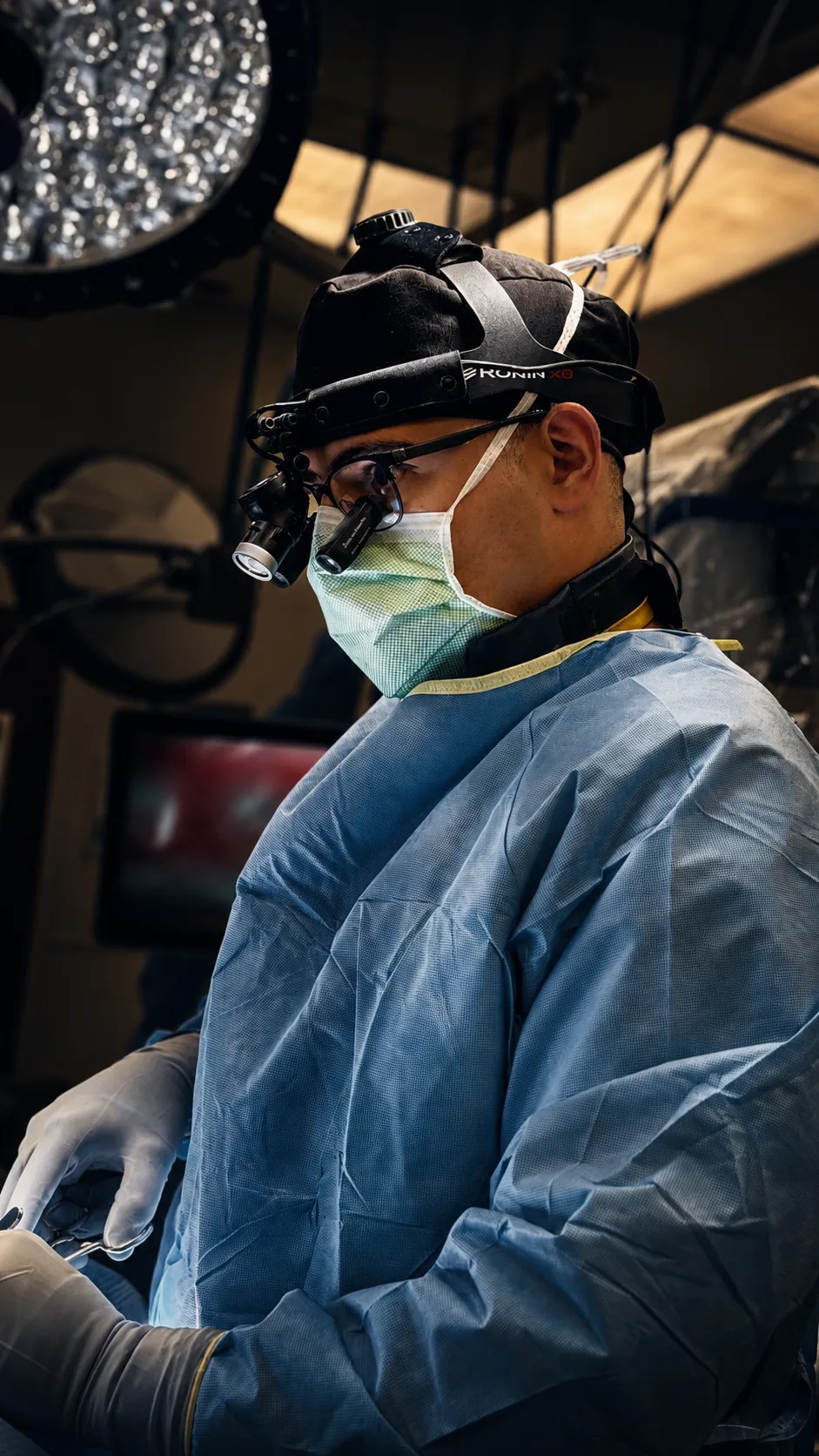 Brandon A. Ortega, MD performing spine surgery