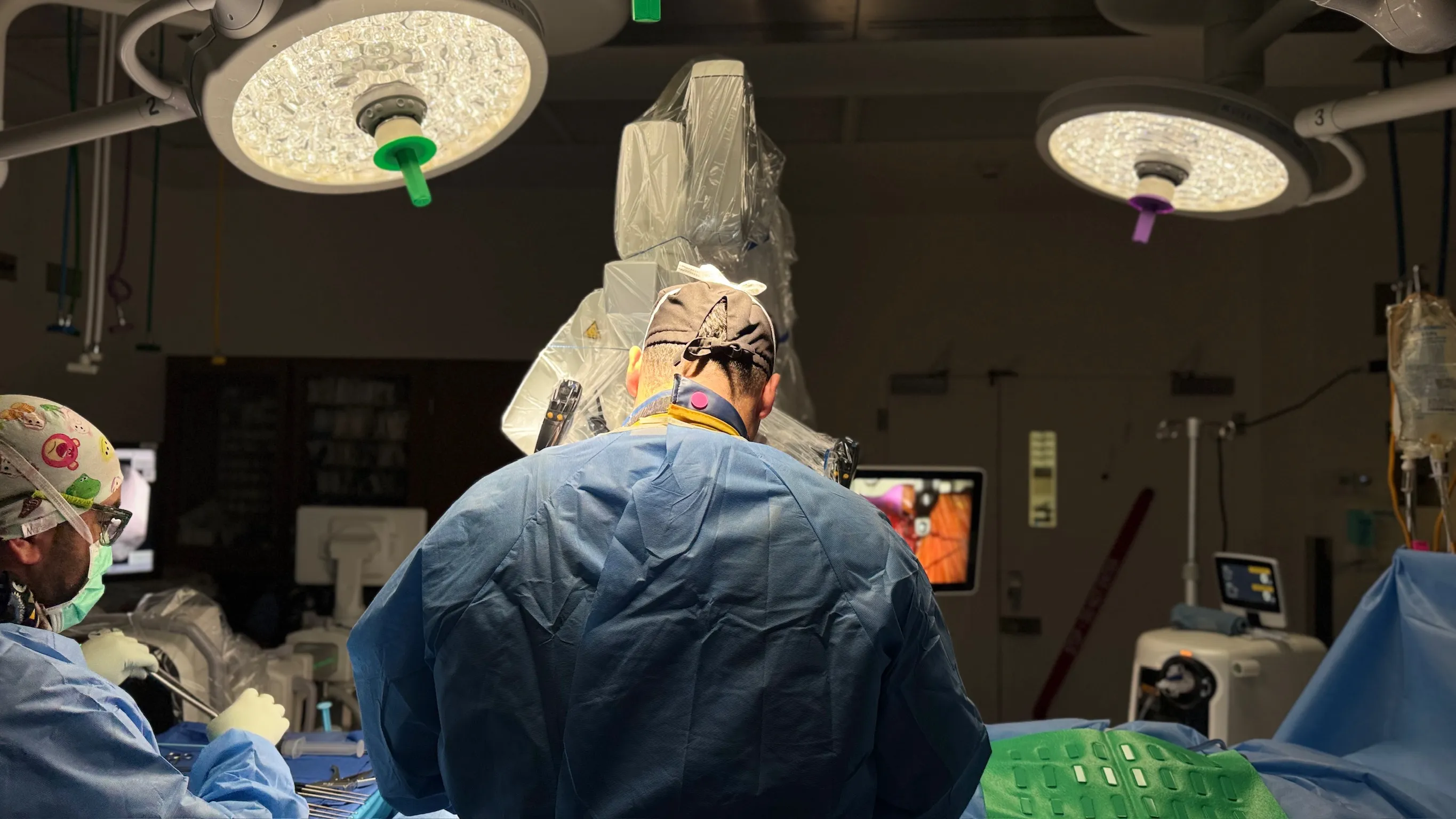 Brandon A. Ortega, MD performing spine surgery